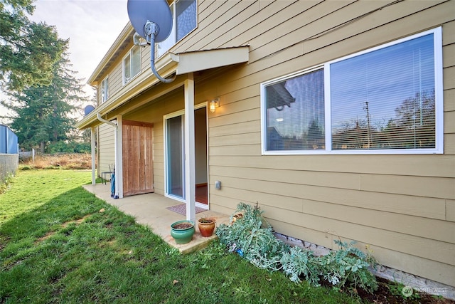 view of side of property with a lawn