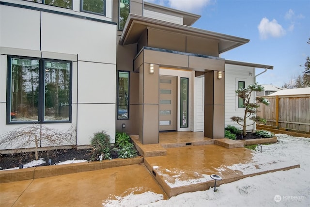 view of snow covered property entrance