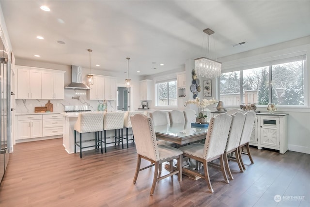 dining space with light wood-type flooring