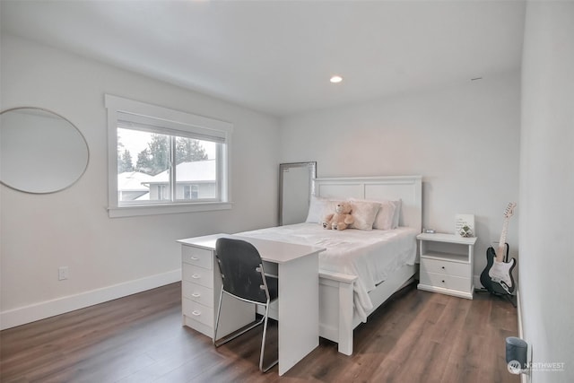 bedroom featuring dark hardwood / wood-style flooring