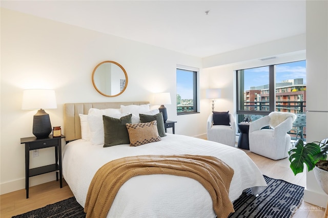 bedroom with light wood-type flooring