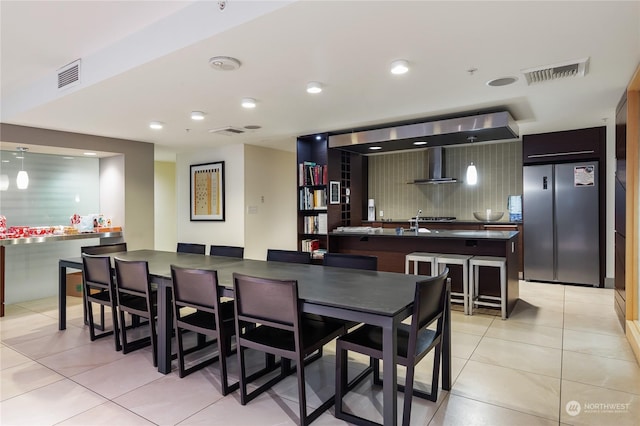 dining area with light tile patterned floors