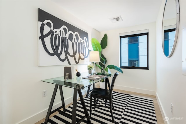 home office featuring hardwood / wood-style floors