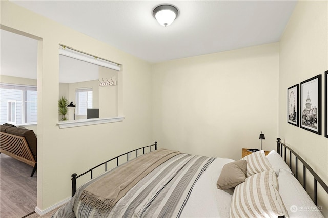 bedroom featuring wood-type flooring