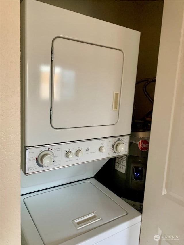 clothes washing area with stacked washer / drying machine