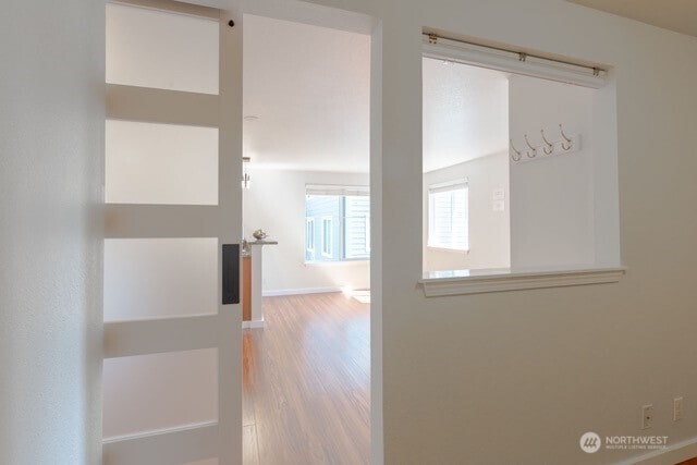 300 10th Ave Unit A203, Seattle, WA 98122 - corridor with wood finished floors and baseboards