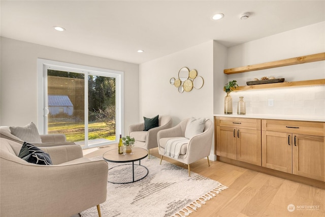 living room with light hardwood / wood-style flooring