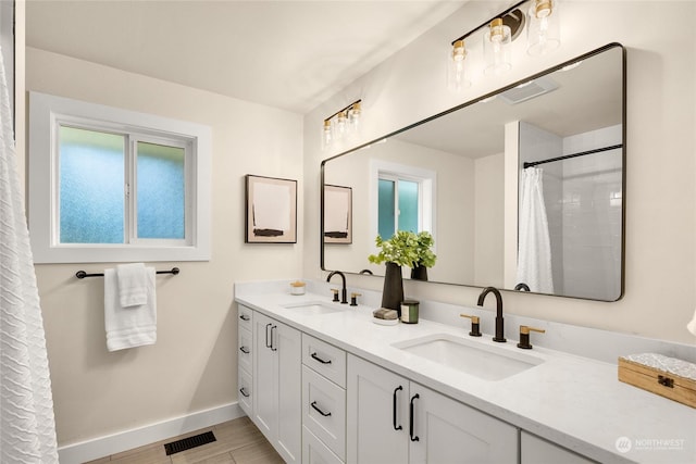 bathroom with hardwood / wood-style flooring and vanity