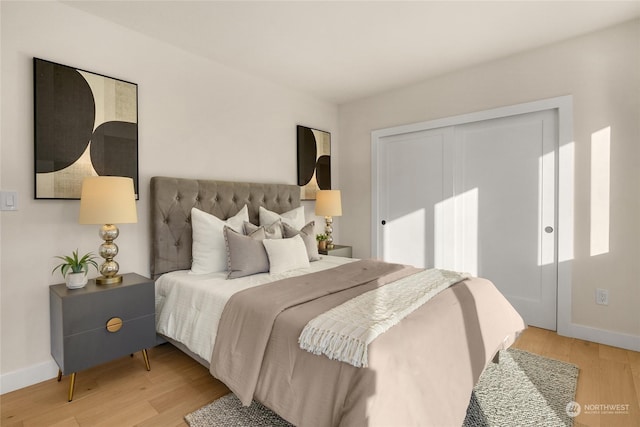 bedroom with a closet and light wood-type flooring