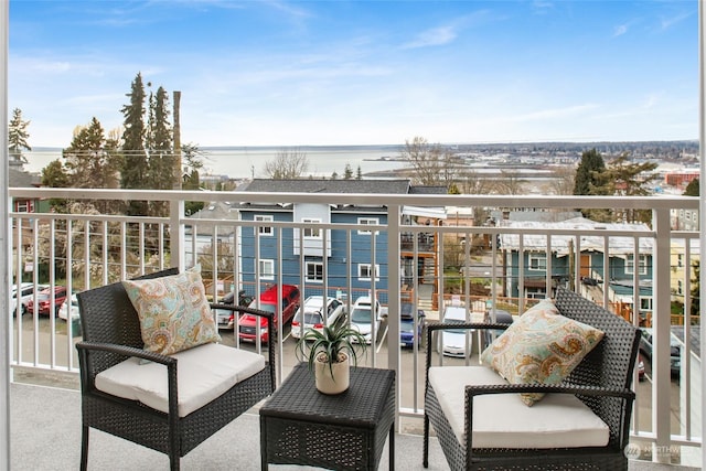 balcony featuring a water view