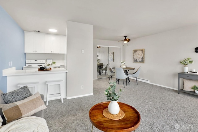 carpeted living room with ceiling fan