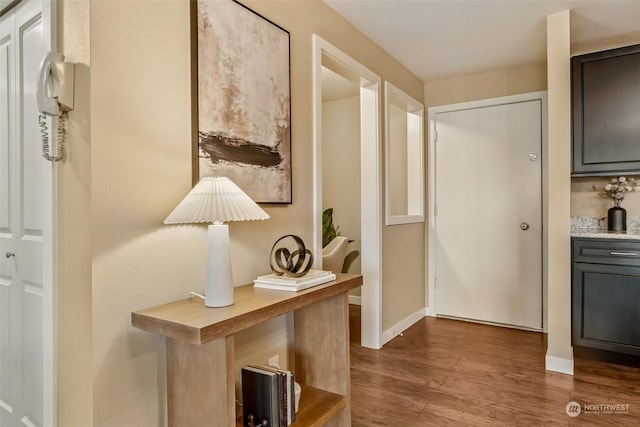 doorway with hardwood / wood-style flooring