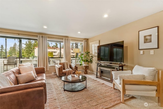 living room with plenty of natural light and carpet