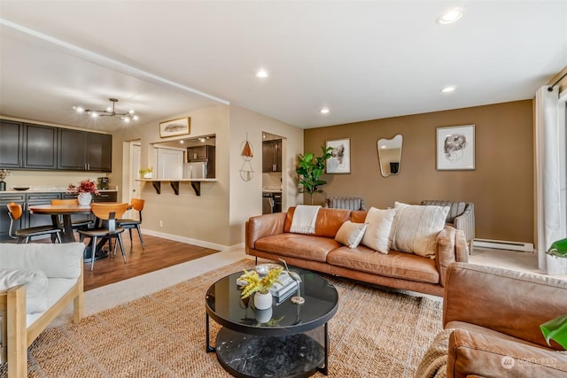 living room featuring a baseboard radiator and light hardwood / wood-style floors