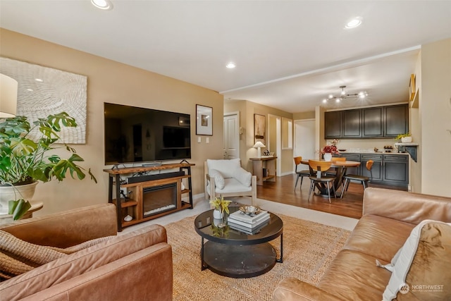 living room featuring a fireplace and light hardwood / wood-style flooring