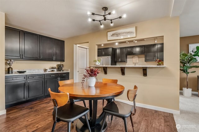 dining area featuring dark hardwood / wood-style flooring