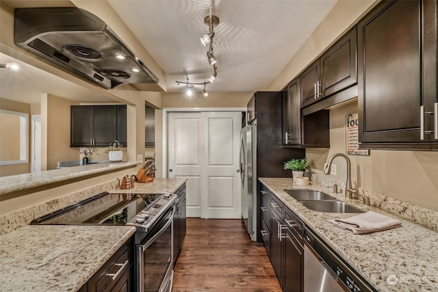 kitchen featuring range hood, sink, dark brown cabinets, and stainless steel appliances