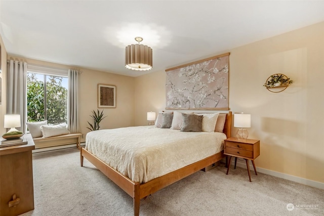 carpeted bedroom with a baseboard radiator