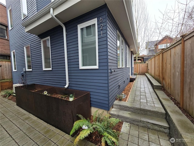 view of side of property featuring a patio area