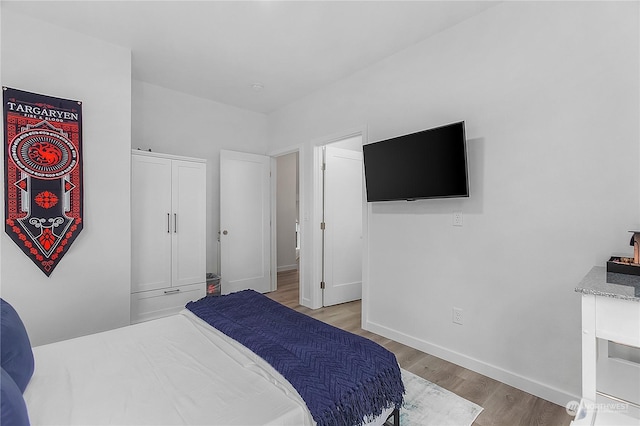 bedroom with light wood-type flooring