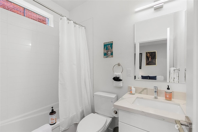 full bathroom featuring shower / tub combo, vanity, and toilet