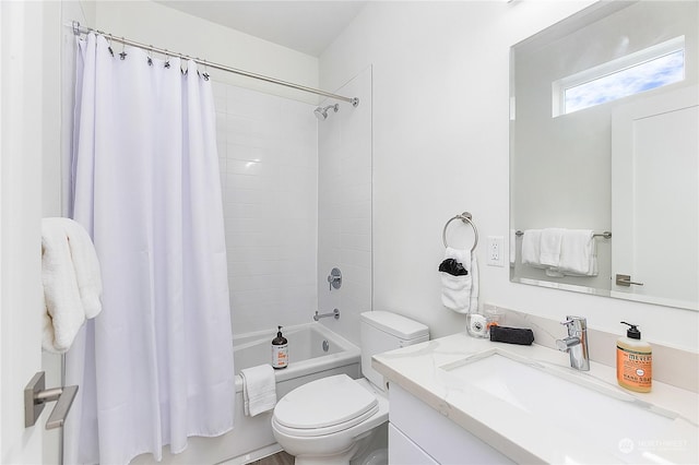 full bathroom featuring vanity, shower / tub combo, and toilet