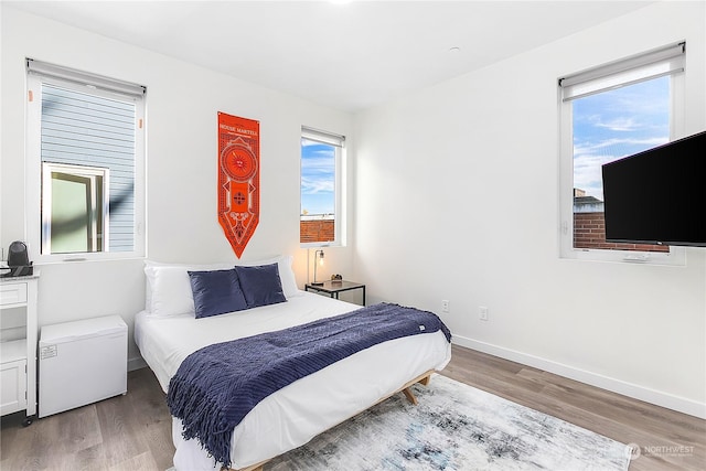 bedroom with hardwood / wood-style flooring