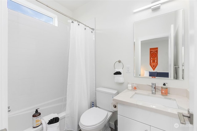 full bathroom featuring vanity, toilet, and shower / tub combo