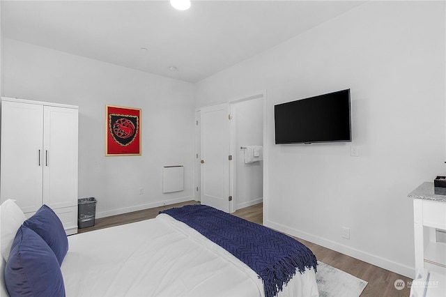 bedroom featuring dark wood-type flooring