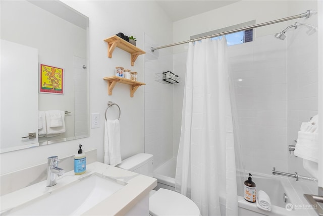 full bathroom with vanity, shower / tub combo with curtain, and toilet