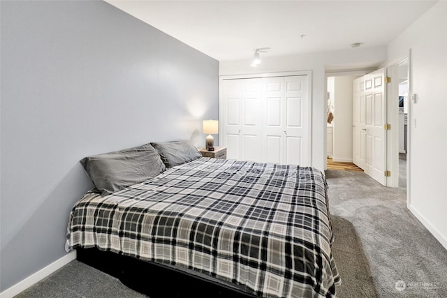 bedroom with a closet and carpet flooring