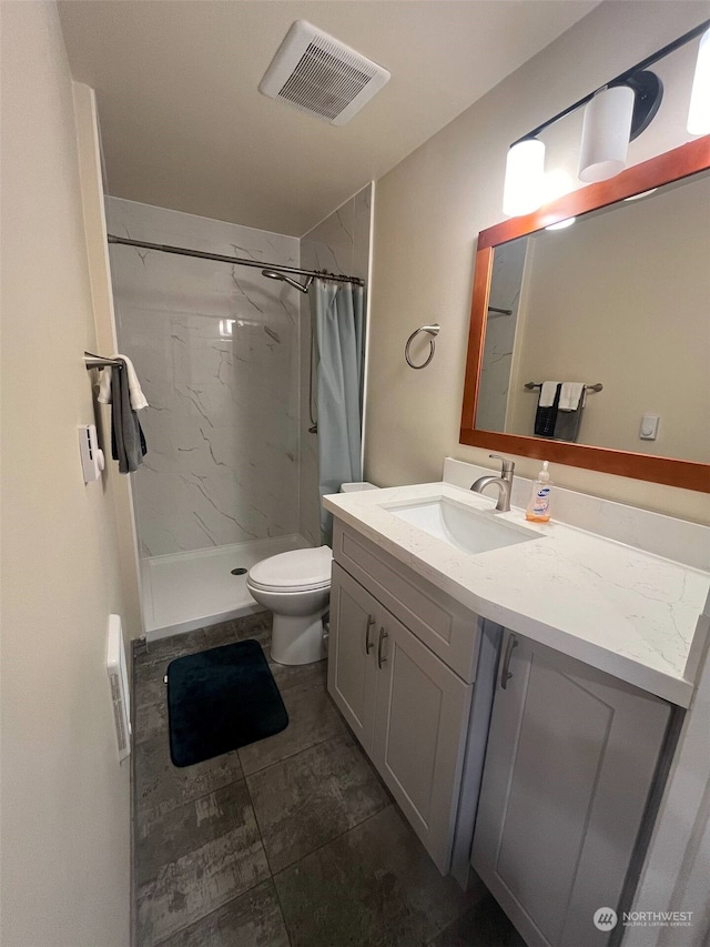 bathroom with vanity, toilet, and a shower with curtain