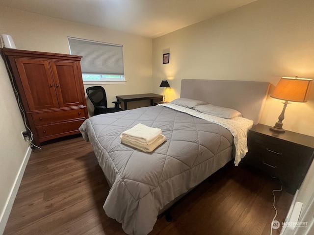 bedroom featuring dark wood-type flooring