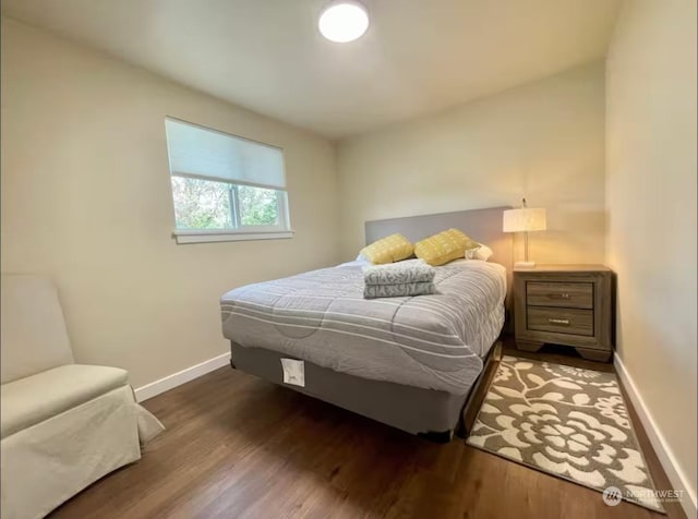 bedroom featuring dark hardwood / wood-style flooring