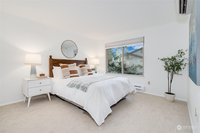 bedroom featuring light carpet