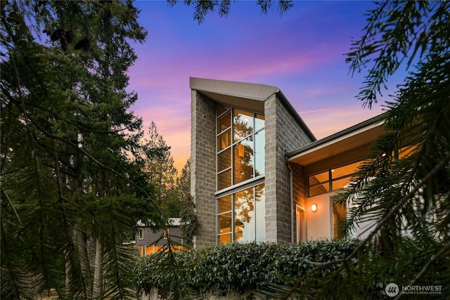 view of property exterior at dusk