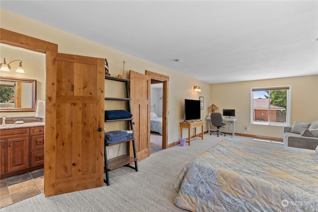 carpeted bedroom with ensuite bathroom