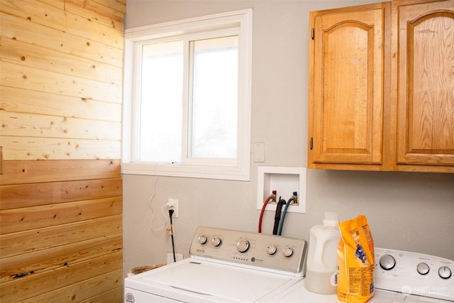 laundry room featuring cabinets and washing machine and clothes dryer