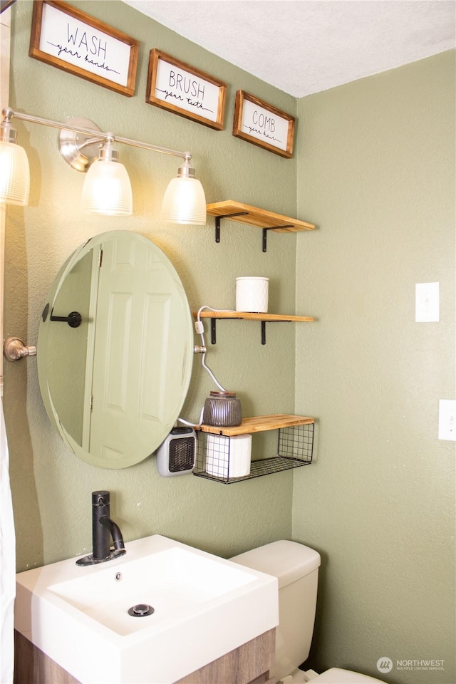 bathroom with toilet and sink