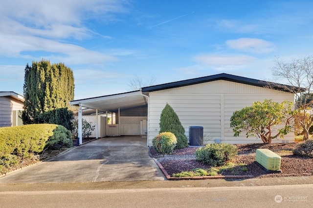 view of side of property featuring a carport