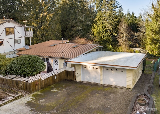 view of front of property featuring an outbuilding and a garage