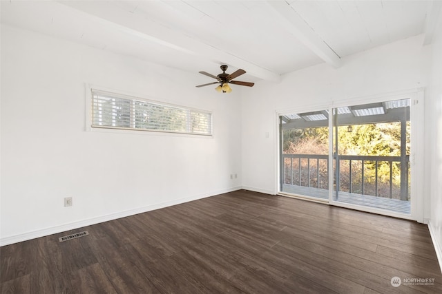 unfurnished room featuring beamed ceiling, plenty of natural light, and dark hardwood / wood-style floors