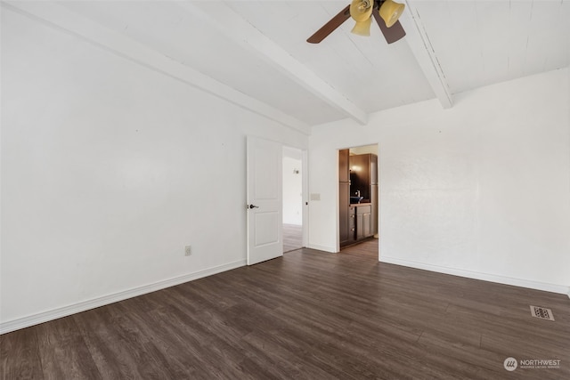 empty room with dark hardwood / wood-style flooring, beam ceiling, and ceiling fan