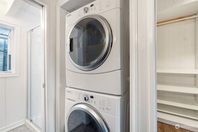 washroom with stacked washer / drying machine