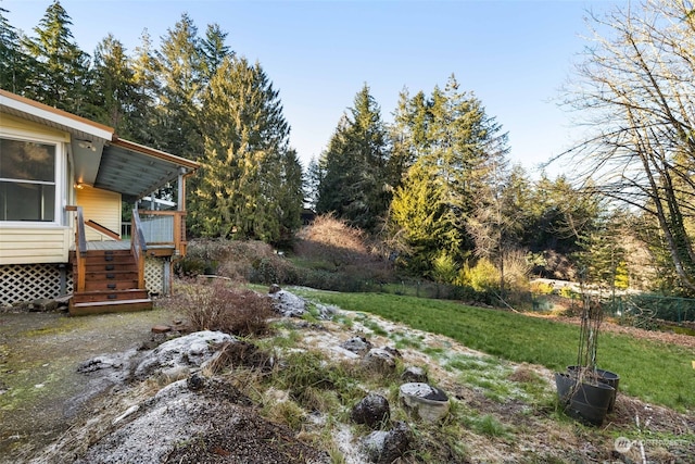 view of yard featuring a wooden deck