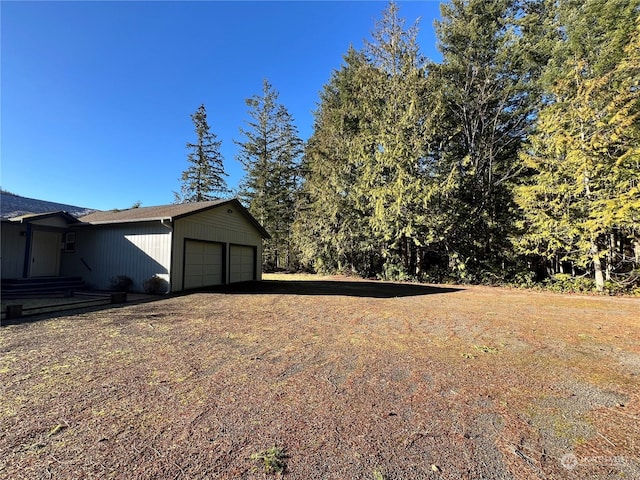 view of yard featuring a garage