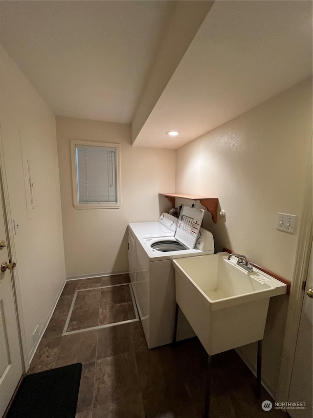 washroom featuring washer and clothes dryer and sink