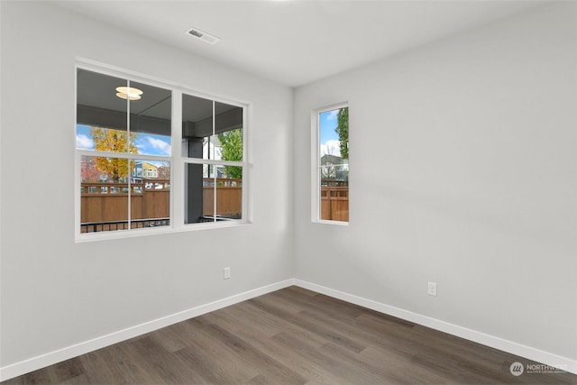 spare room with hardwood / wood-style floors