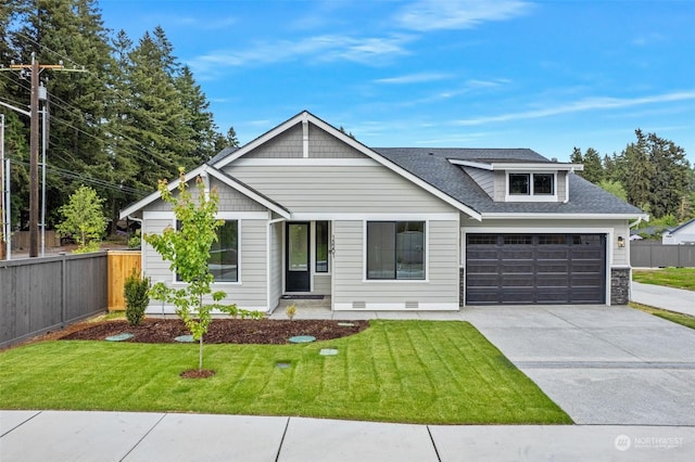 view of front facade featuring a garage and a front lawn