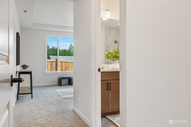 hallway with light carpet